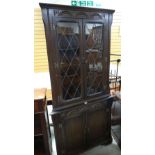 A lunette carved reproduction corner cabinet with glazed top Condition reports provided on request