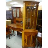 A reproduction serpentine hall table and a yew effect semi-glazed corner cabinet Condition reports