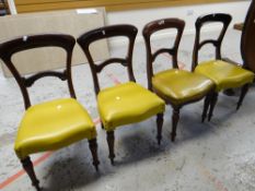 A set of four antique mahogany dining chairs with stuff-over seats Condition reports provided on