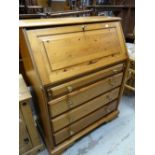 Modern pine full front bureau having fitted interior above four drawers, 91cms wide x 111cms high