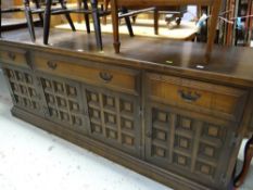 A reproduction Jacobean-style long darkwood sideboard, 206cms wide Condition reports provided on