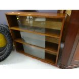 A vintage three-tier sliding door bookcase Condition reports provided on request by email for this