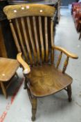 An antique elm Windsor armchair Condition reports provided on request by email for this auction