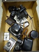 Collection of vintage cameras, lenses including Daccora, Dignette German camera, Canon SLR digital