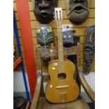 A mid-century acoustic guitar Condition reports provided on request by email for this auction