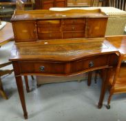 A reproduction serpentine ladies desk Condition reports provided on request by email for this