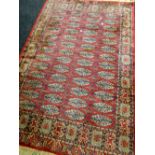 A red ground medallion patterned Persian carpet, 208cms long Condition reports provided on request