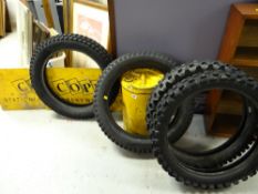 A vintage yellow tin Shell oil can, four motorcycle tyres, two copywrite advertising signs Condition
