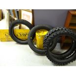 A vintage yellow tin Shell oil can, four motorcycle tyres, two copywrite advertising signs Condition