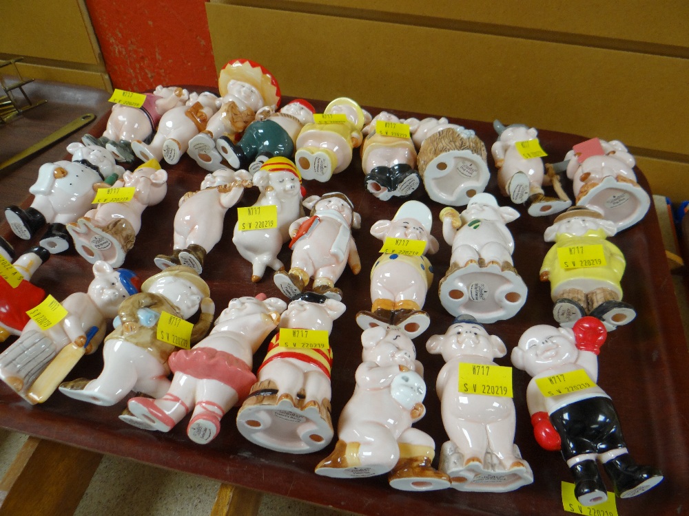 Collection of novelty ceramic 'Piggies' together with display stand Condition reports provided on