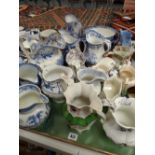 A quantity of Welsh & Staffordshire pottery transfer jugs together with an Ironstone bowl & a lustre