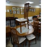 A modern circular / oval dining table and four chairs Condition reports provided on request by email