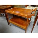 A yew effect reproduction tea trolley Condition reports provided on request by email for this