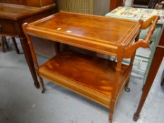 A yew effect reproduction tea trolley Condition reports provided on request by email for this