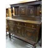 A 1920s dark oak court dresser, 170(h) x 155(l) x 61(d)cms Condition reports provided on request