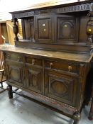 A 1920s dark oak court dresser, 170(h) x 155(l) x 61(d)cms Condition reports provided on request