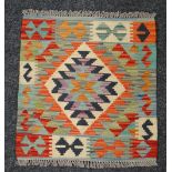 A small square rug, 54 x 52cms Condition reports provided on request by email for this auction