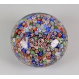 BACCARAT CARPET-GROUND PAPERWEIGHT dated 1847 with in tightly packed canes of floral bird and animal