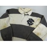 A 1950s BARBARIANS RUGBY UNION JERSEY NUMBER 4 MATCH WORN BY GARETH GRIFFITHS in traditional black