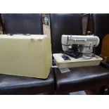 Cased Merritt electric sewing machine E/T