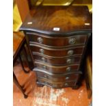 Reproduction narrow serpentine fronted chest of drawers and a dralon footstool