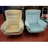 Pair of mid Century style swivel egg shaped easy chairs