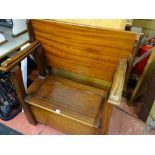 Compact mahogany settle with folding back and box seat