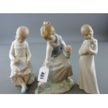 Lladro figurine of young girl with bunch of flowers and two Nao figurines - seated child with