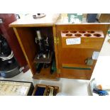 Cased 'Prior of London' black enamelled microscope (no extra lenses)