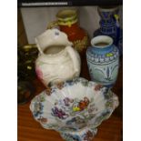 Floral comport and a pottery toilet jug and three other vases