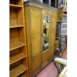 Polished wardrobe with centre mirrored door and railback dressing table with two drawers (near