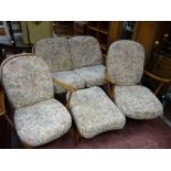 Ercol medium suite comprising two armchairs, footstool and two seater settee