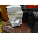 Boxed digital camera and a pair of modern binoculars