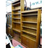 Two good oak effect open bookcases, one with two base cupboards and a glass fronted bookcase