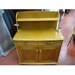 Probably Ercol two door and two drawer sideboard with upper shelf rack