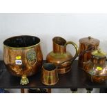 Five items of copperware including a tea caddy, good planter stand with three brass supports and