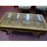 Oriental deep carved glass topped coffee table