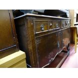 Polished wood sideboard with two drawers over carved base drawers etc