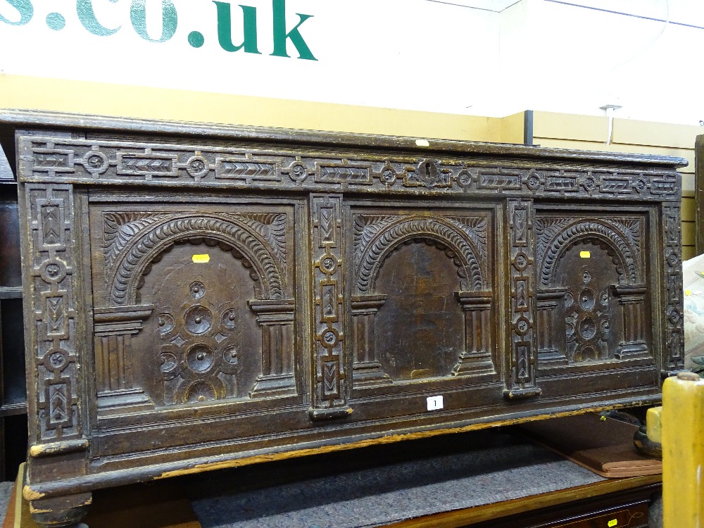 Wooden blanket box with carved three panel front