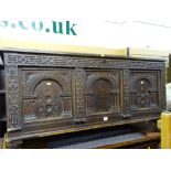 Wooden blanket box with carved three panel front