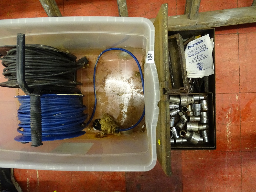 Two extension cable reels and a metal box containing quantity of mechanic's sockets, drills etc E/T