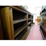 Polished wood three section multi-shelf bookcase, approx 3m long