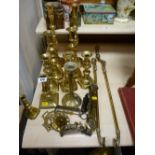 Several pairs of brass candlesticks and other brass items including scales, horse brasses etc