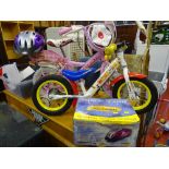 Apollo Cupcake infant's bicycle with stabilizers, an Apollo Whizzer infant's bicycle and boxed Storm