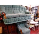 Modern compact green floral upholstered three seater settee and matching armchair