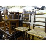 Smoked glass topped nest of three tables and two ladderback rush seated chairs