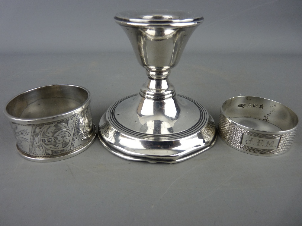 Chester silver squat candlestick and two hallmarked silver napkin rings