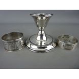 Chester silver squat candlestick and two hallmarked silver napkin rings