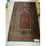 Old Baluchi prayer rug, multi-bordered deep colours with central red and blue ground panel, 148 x 88