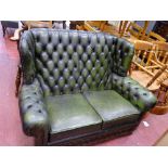 Green leather effect button back Chesterfield settee